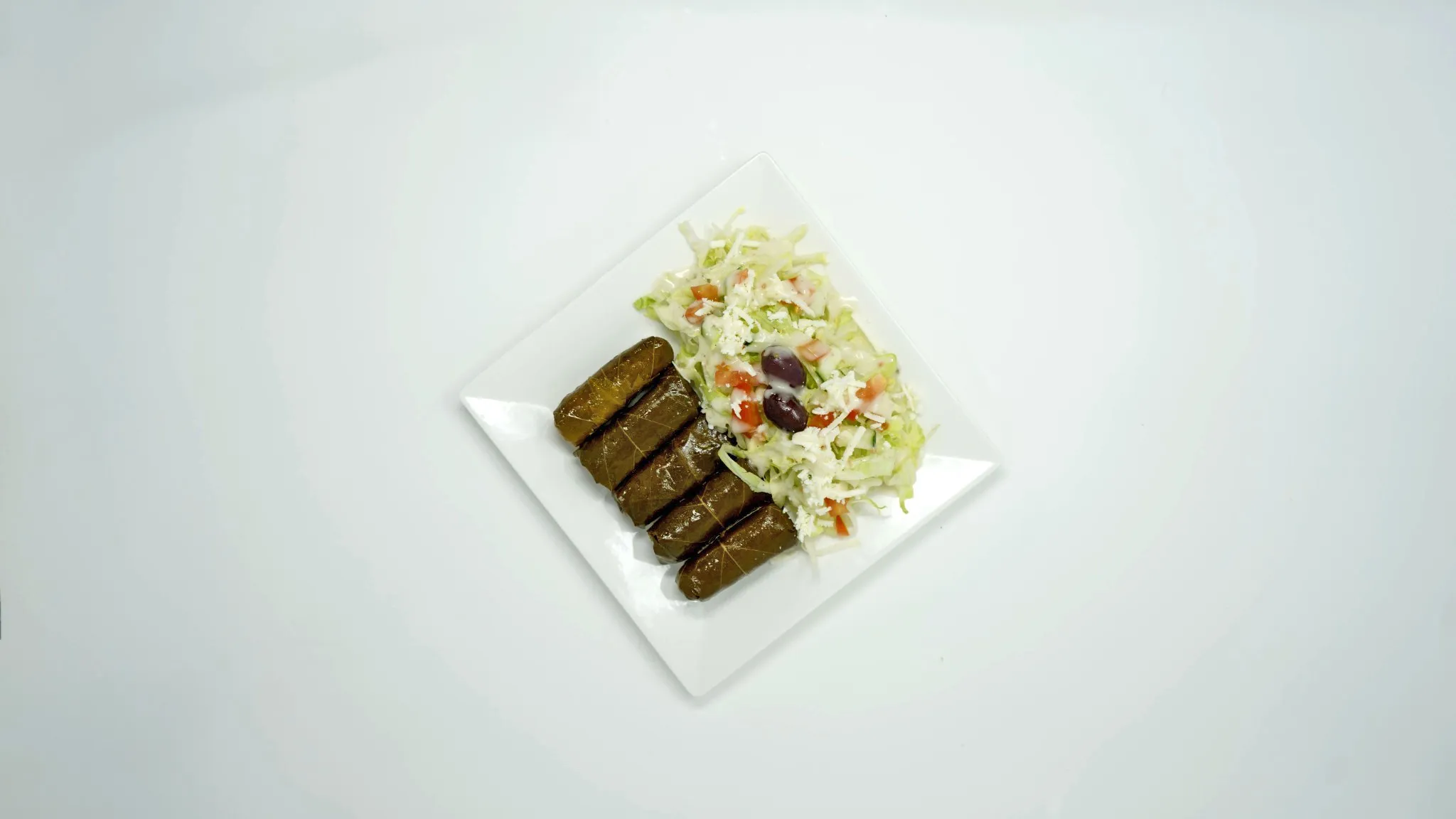 Stuffed Grape Leaves with Salad — Marhaba Grill, Minneapolis